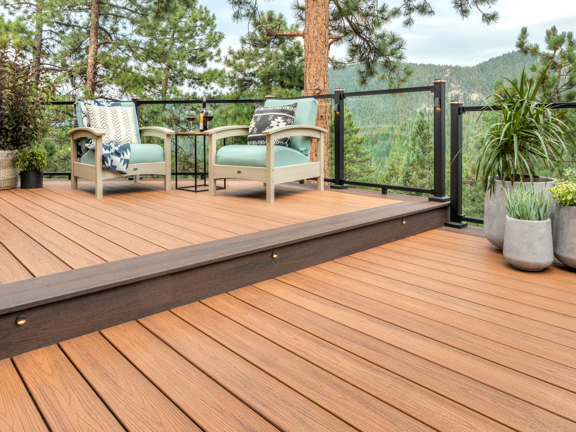 Composite deck with glass railing and mountain views